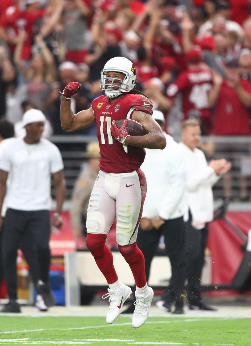 Wide receiver Larry Fitzgerald celebrates after making a catch in the fourth quarter during a 2019 game against the Lions.